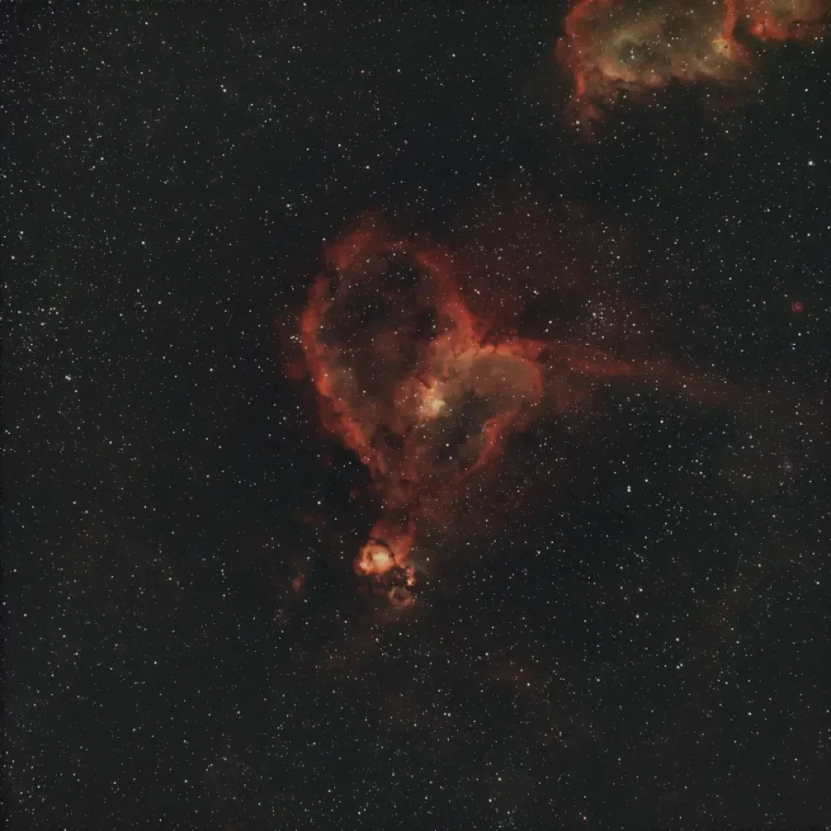 Scroll the slider to switch between the images of the Heart Nebula and its starless version