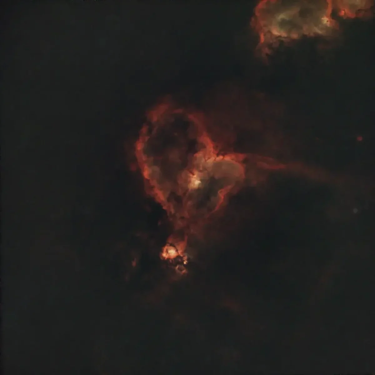 Scroll the slider to switch between the images of the Heart Nebula and its starless version